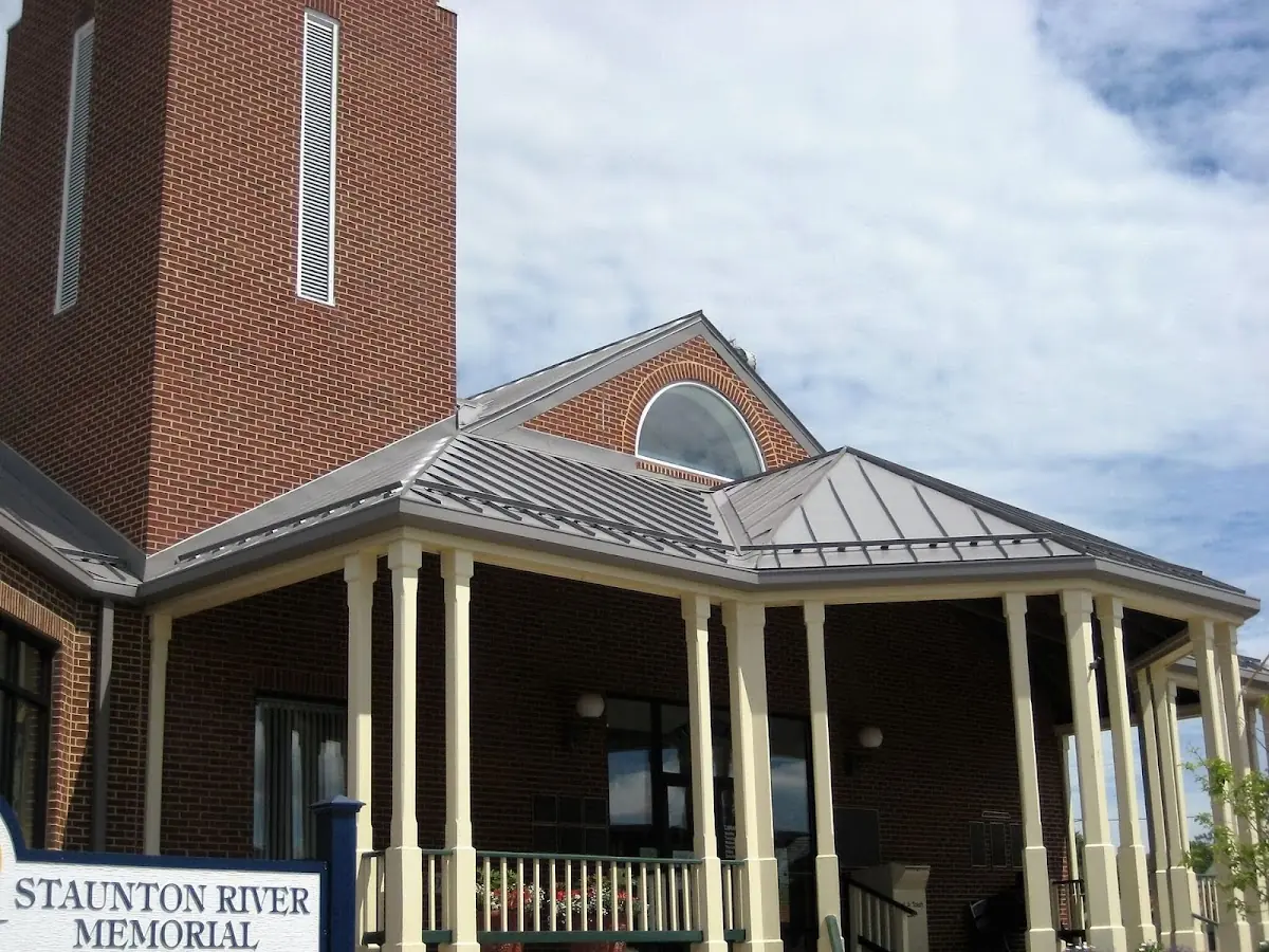 Skilled roofing craftsmen working on a residential roof in Windsor